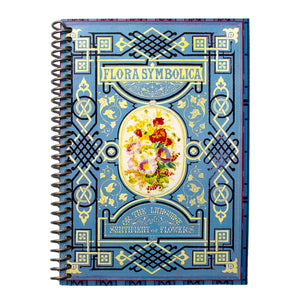 A travel-sized spiral notebook featuring a vintage book cover: Flora Symbolica or The Language and Sentiment of Flowers. Features a floral illustration surrounded by an ornate frame. The colors are sky blue, black, red, pink and gold.